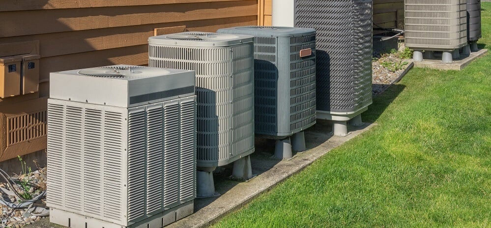 several AC units outside apartment complex