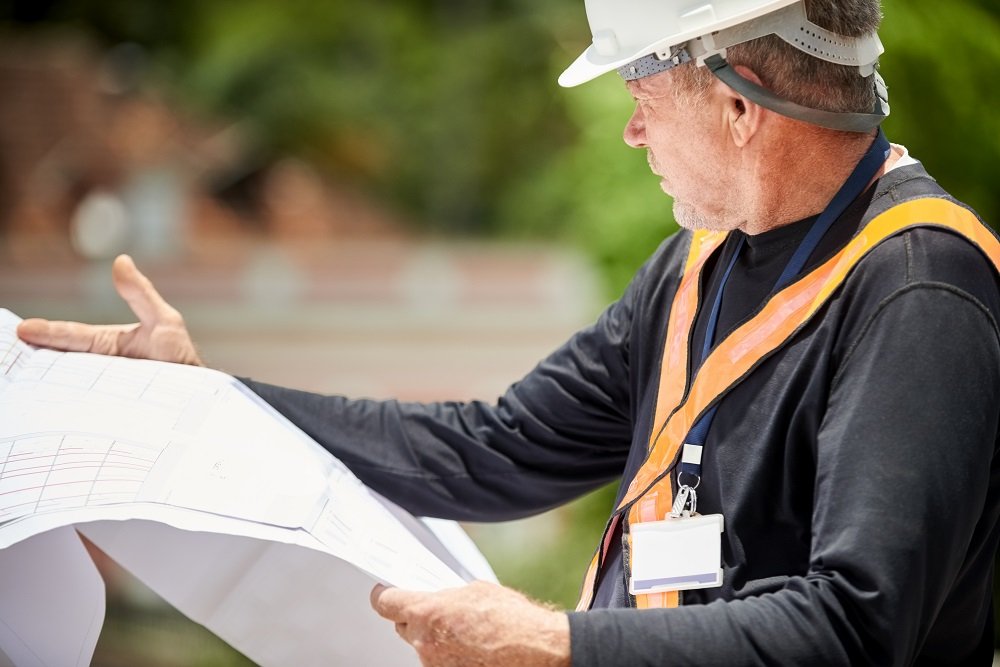 a constructor project manager looking at the plans