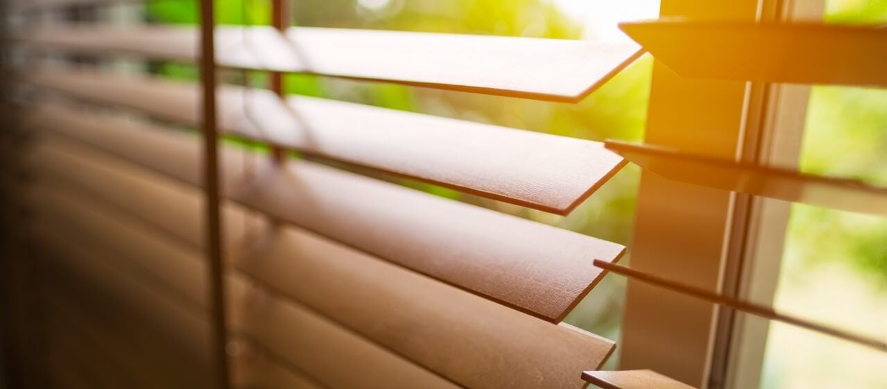 close up of wooden blinds on a residential window