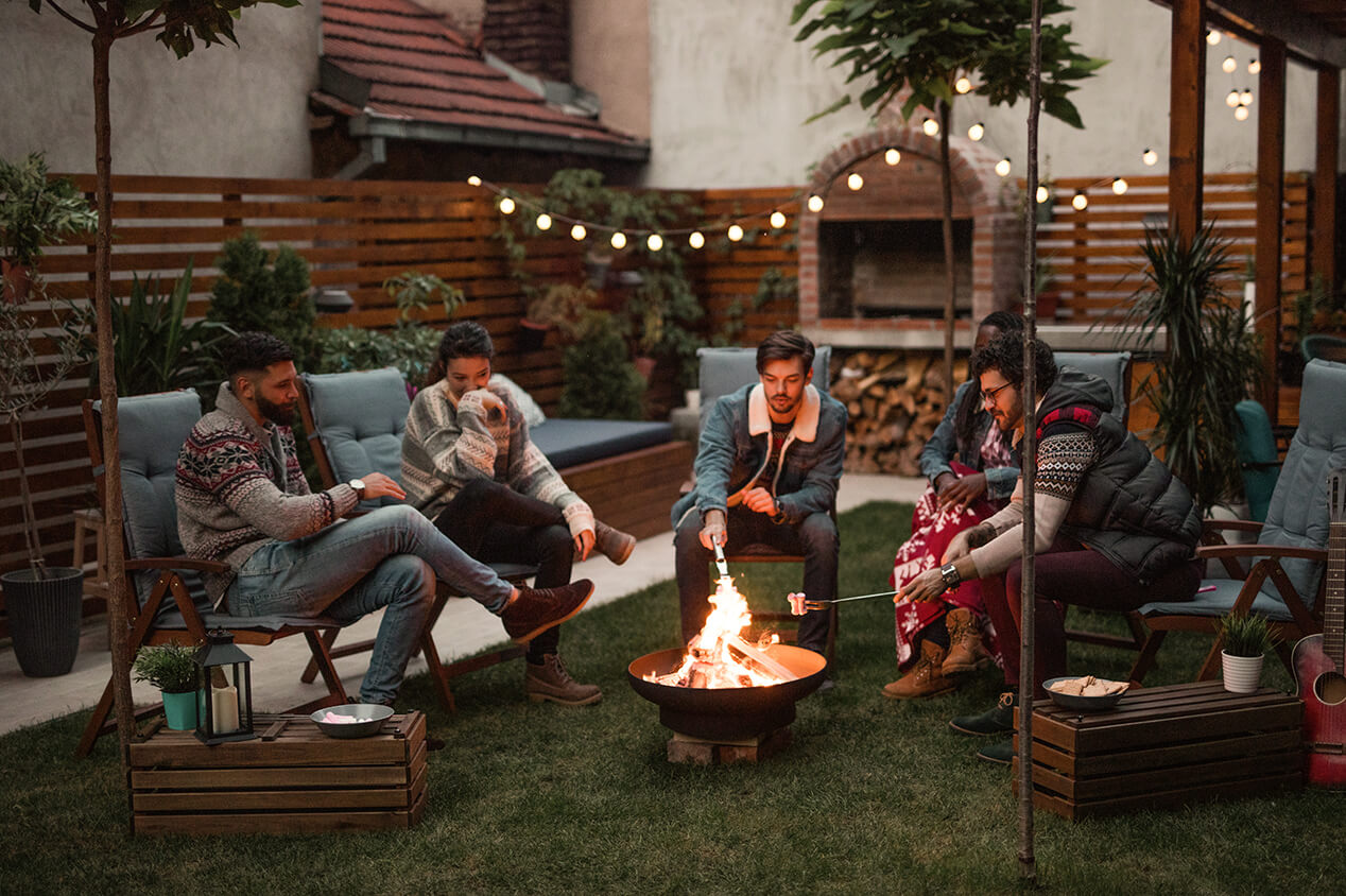 friends outside around fire pit