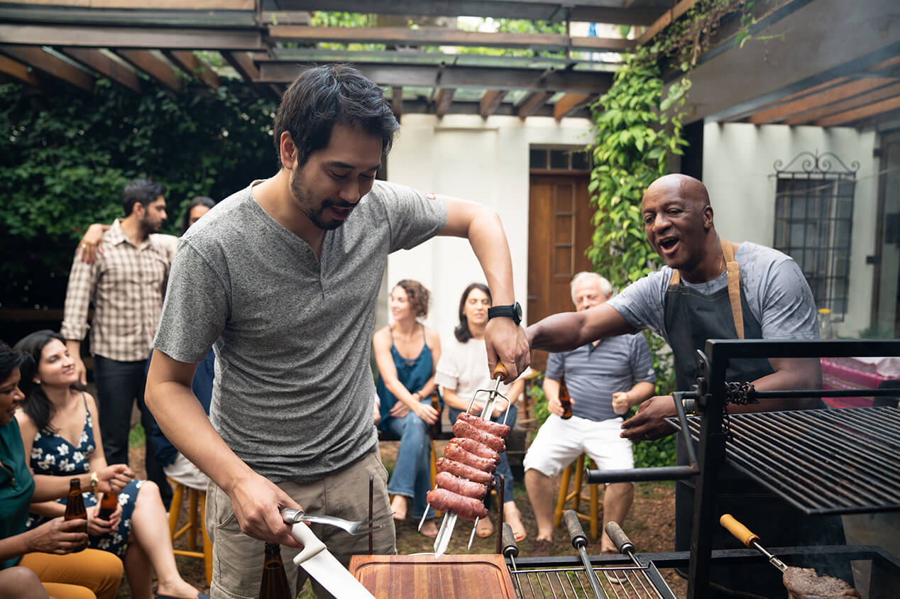 friends outside grilling