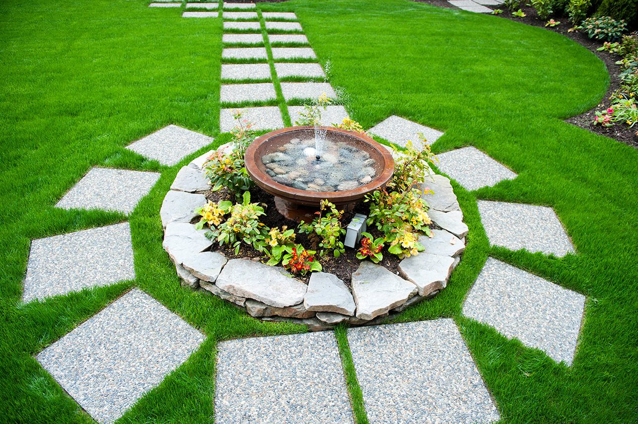 stone walkway around flowers