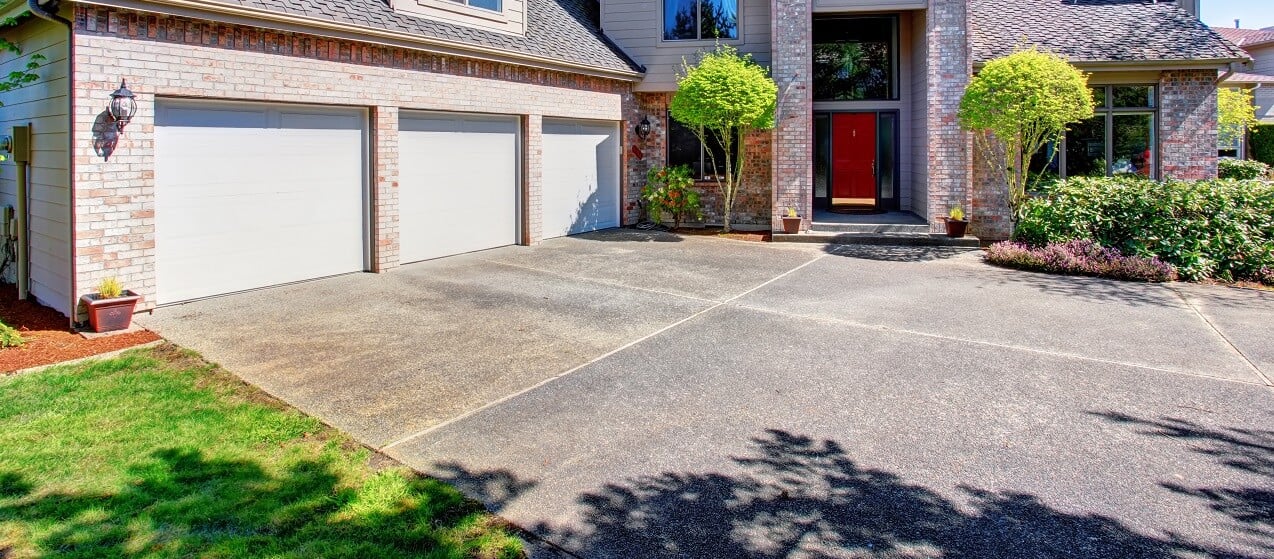 concrete driveway in front of modern house