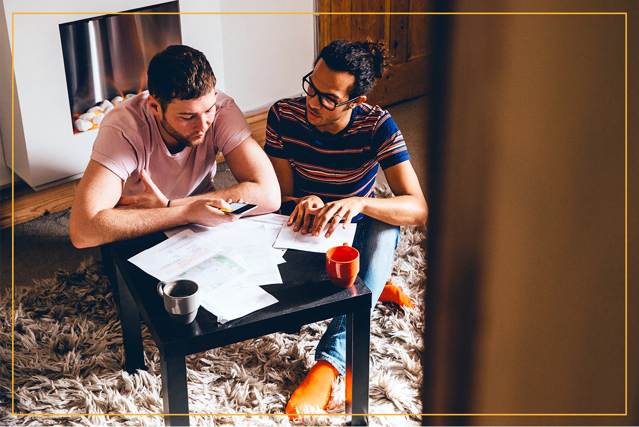 couple discussing documents at table