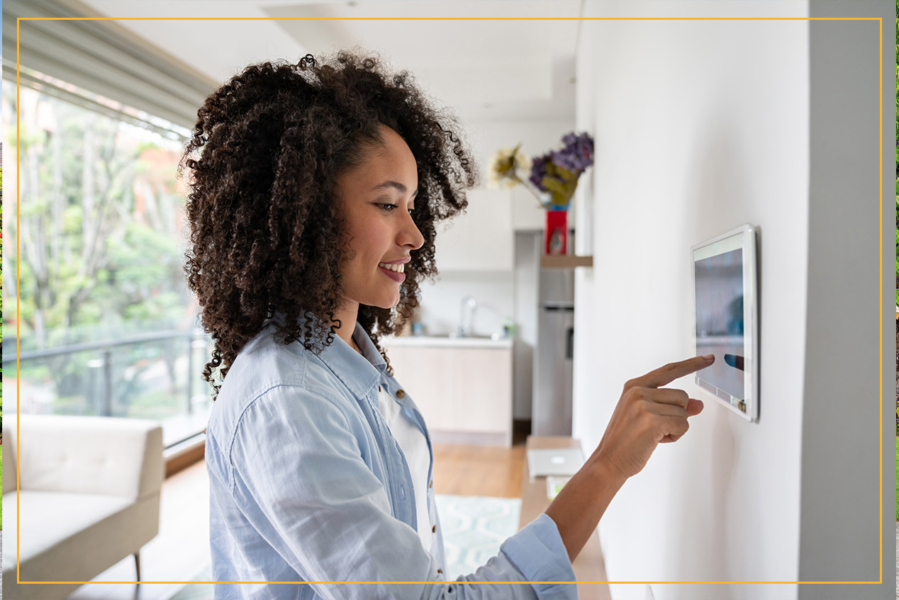 woman setting thermostat