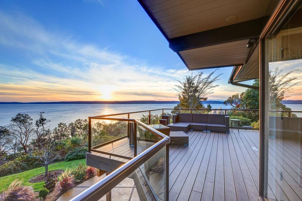 A wooden deck with lake views