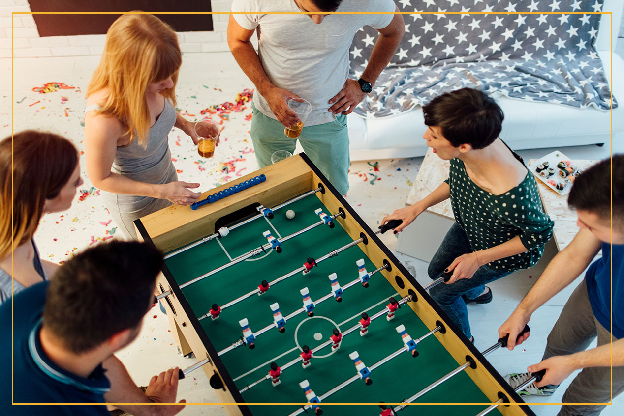 friends playing foosball 