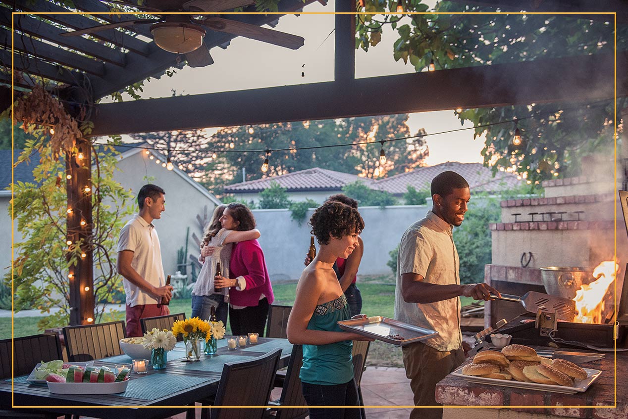 group BBQ on back patio under pergola  