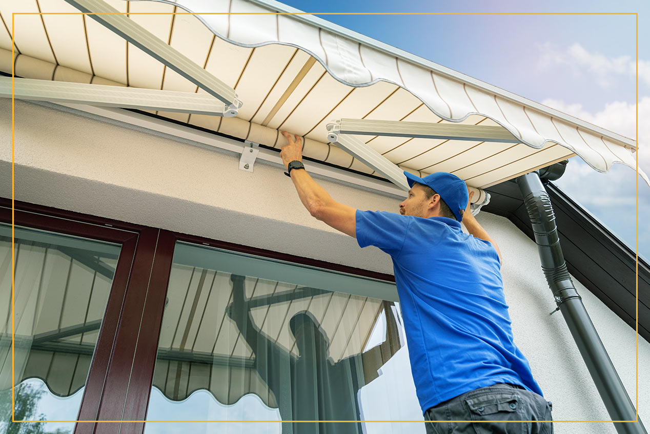 man installing retractable canopy