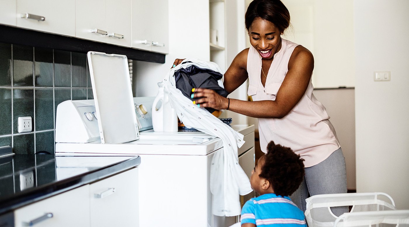 mom and son doing laundry together