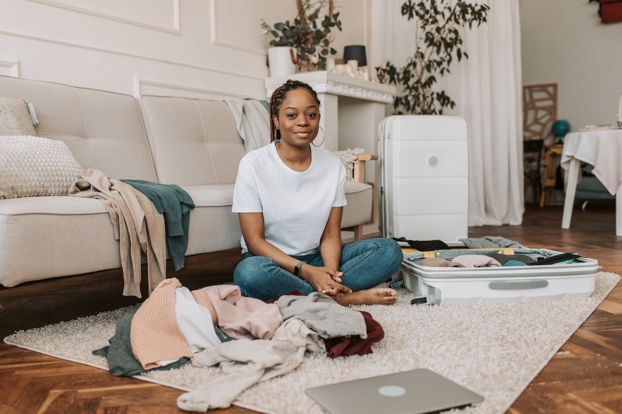 woman sitting on the floor with laundry