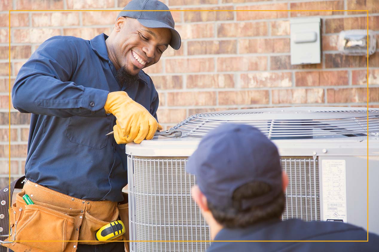 repairmen fixing HVAC unit outside of home