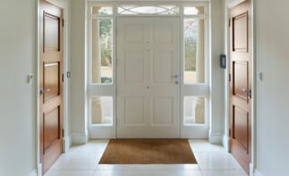 A front door entrance with tile flooring