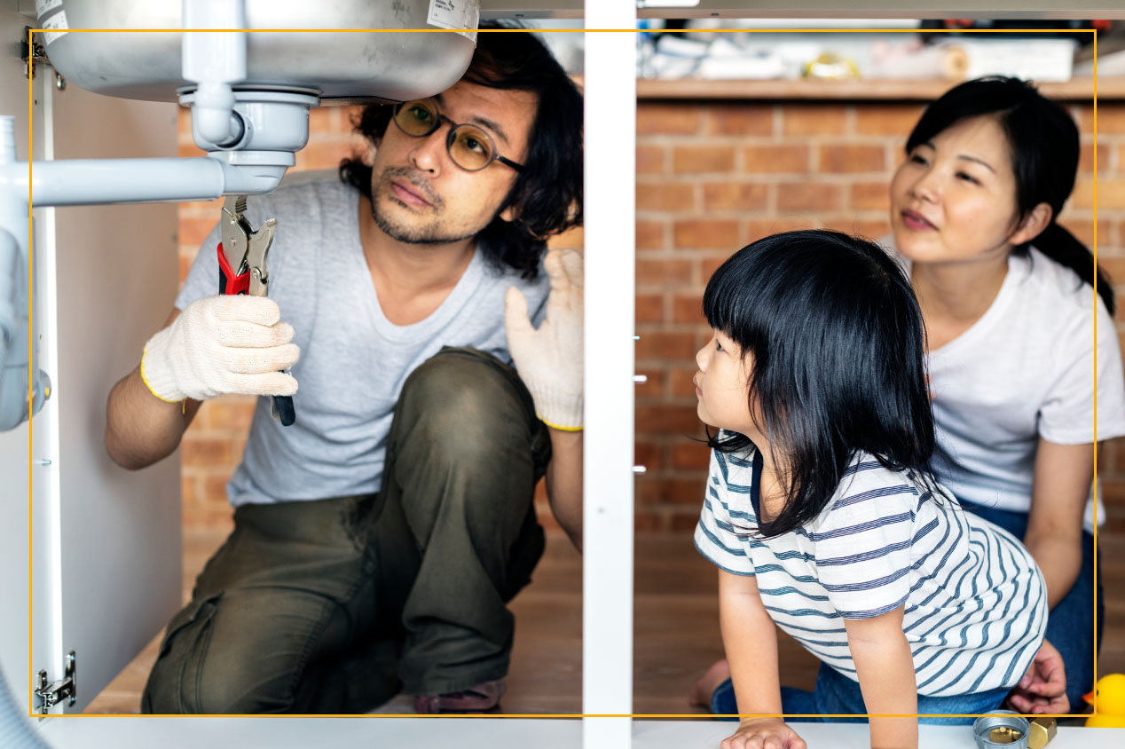 Family together and dad fixes sink plumbing