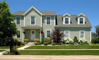 exterior of home with vinyl siding and front yard