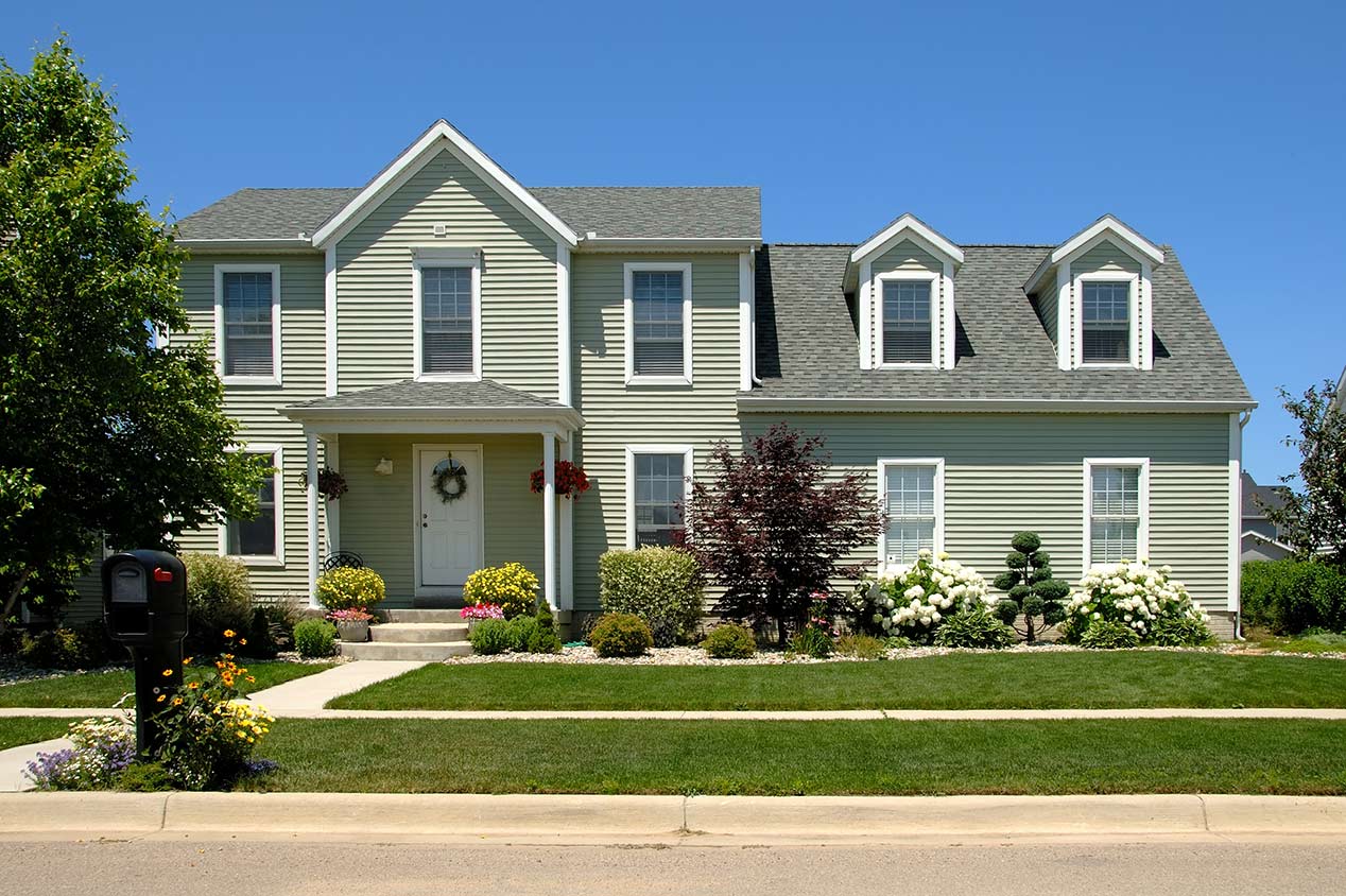 exterior of home with vinyl siding and front yard