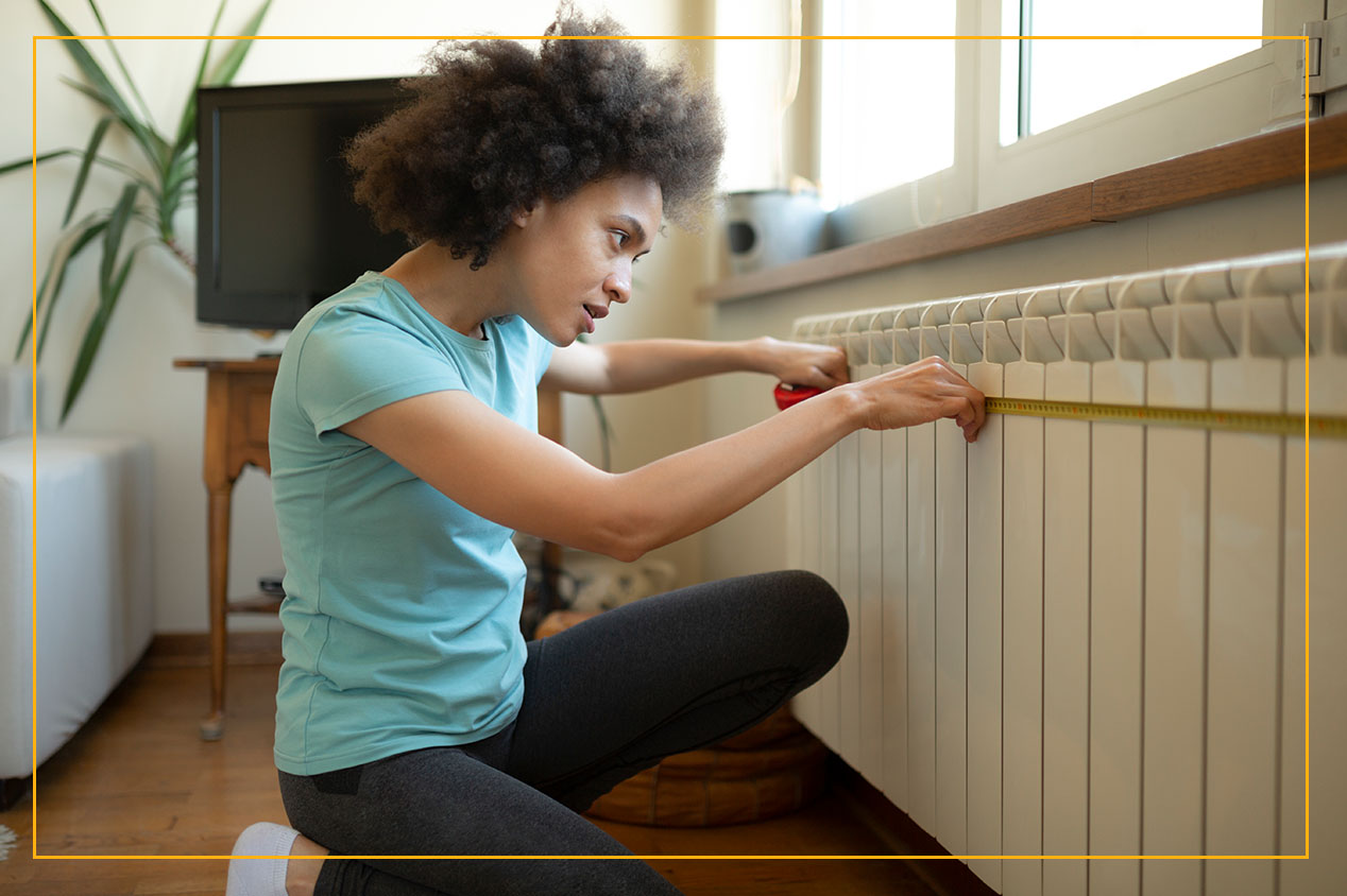 woman checking radiator