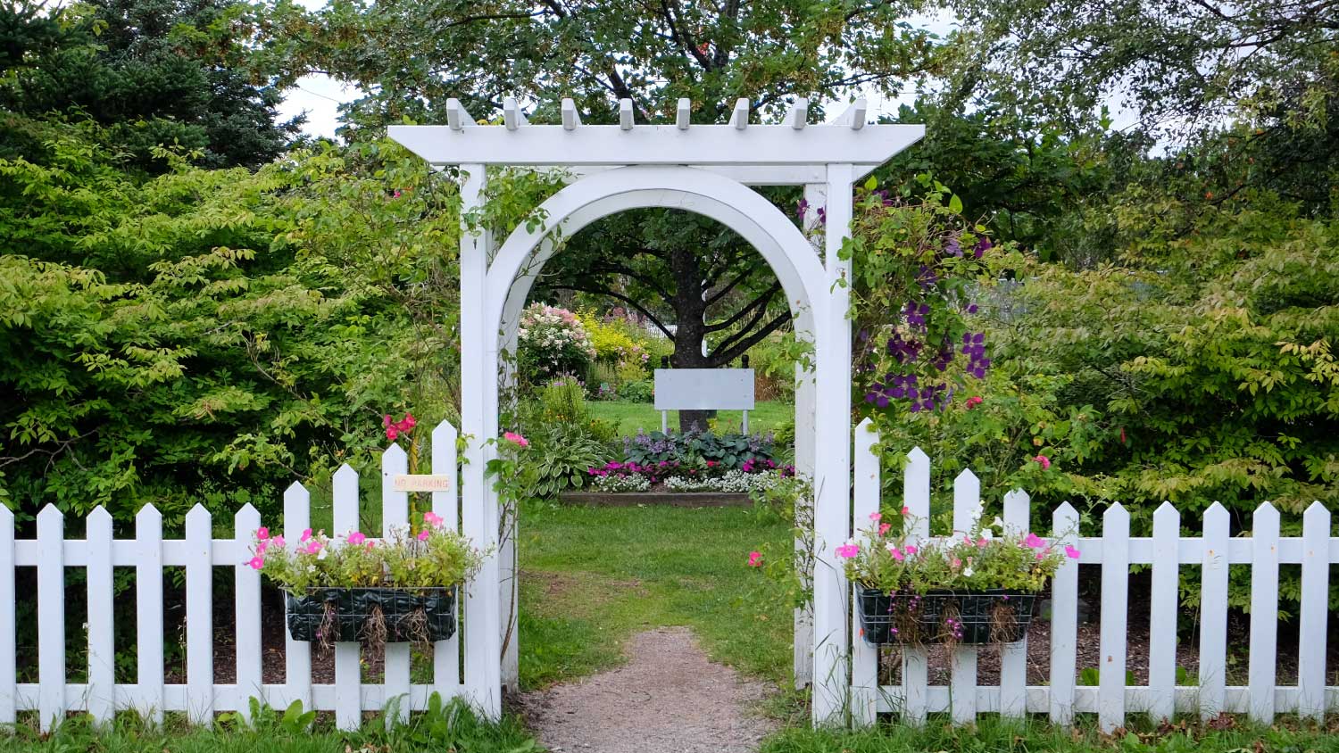 A white wooden arbor
