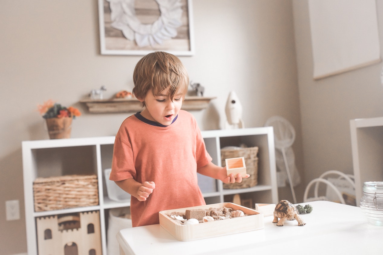 Alt text header: kid playing with toys at home 