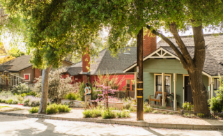 suburban neighborhood with woman running