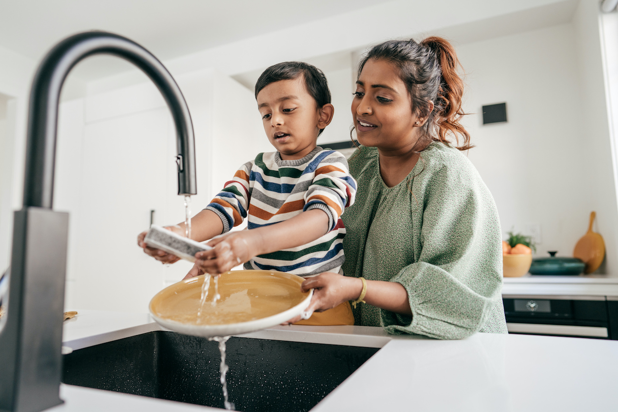 mom and son washing dishes